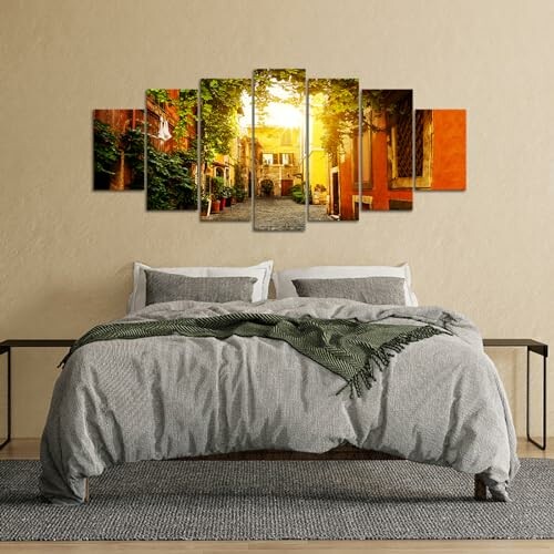 Cozy bedroom with a large bed and sunset wall art