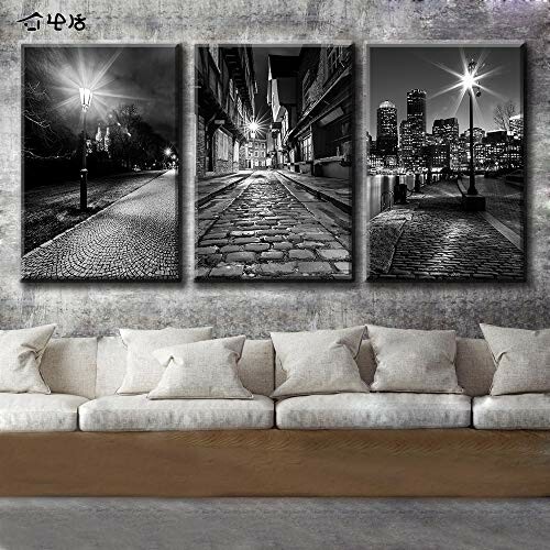 Black and white cityscape wall art above a sofa.