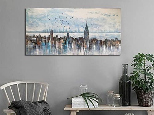 Abstract cityscape painting on wall above shelf with decor