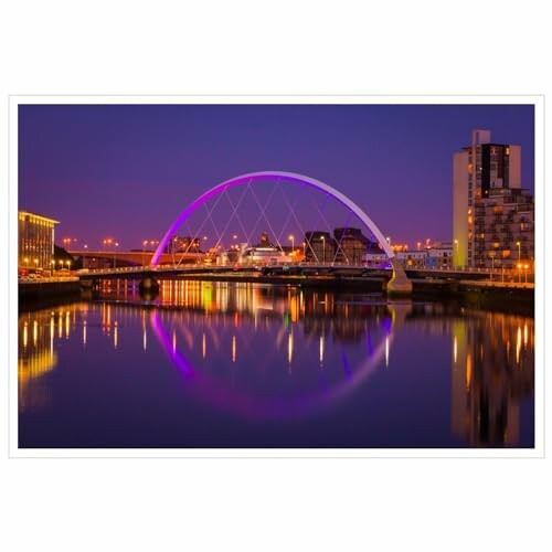 Night view of a lit-up bridge over a calm river in Glasgow.