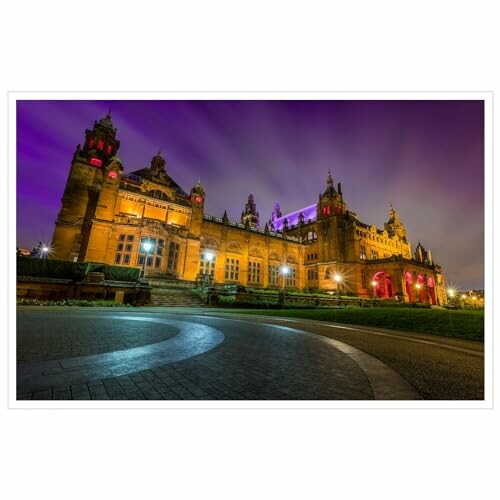 Kelvingrove Art Gallery illuminated at night with purple sky