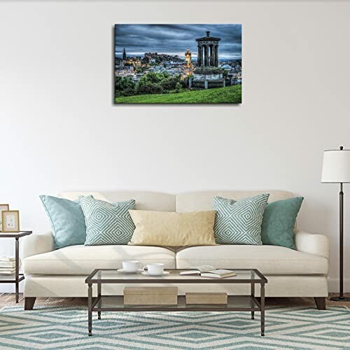 Living room with a white sofa, decorative pillows, and wall art.