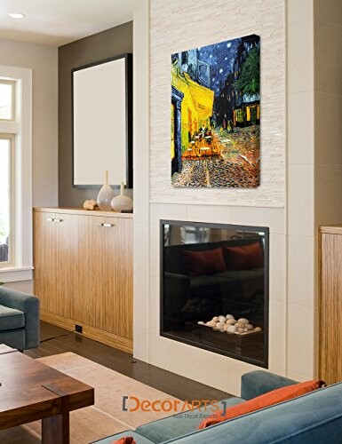 Modern living room with Van Gogh painting above fireplace.