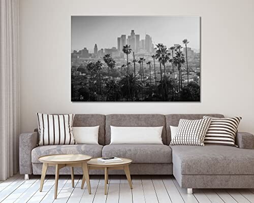 Living room with a gray sofa and a black and white cityscape wall art.