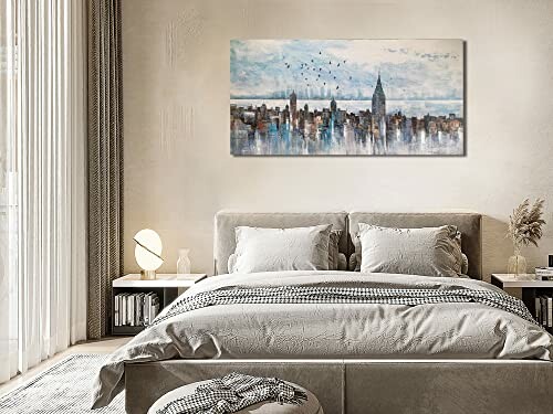 Modern bedroom with cityscape wall art above bed