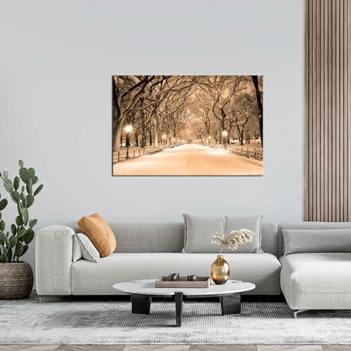 Modern living room with a large wall art of a snowy pathway.