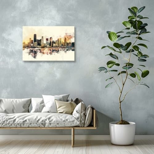 Modern living room with sofa, plant, and cityscape artwork on the wall.