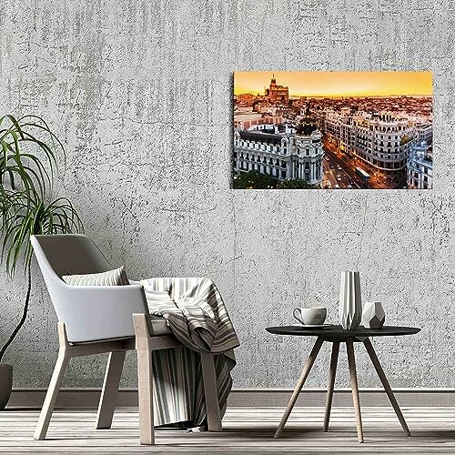 Modern living room with cityscape art on wall.