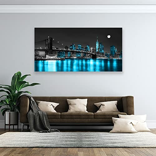 Living room with a brown couch and cityscape wall art.