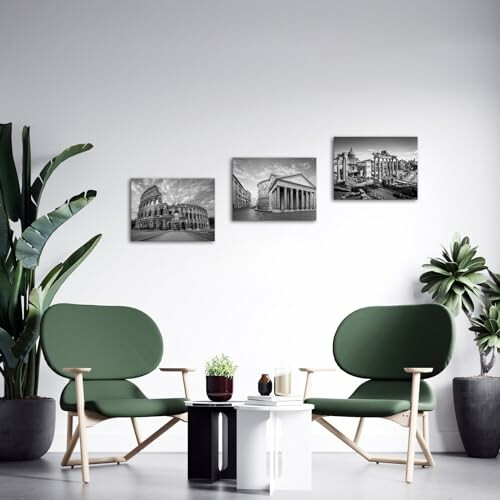 Modern living room with green chairs and black-and-white cityscape photos on the wall.