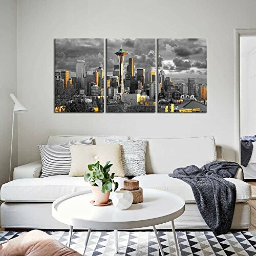 Living room with modern cityscape wall art and white sofa.