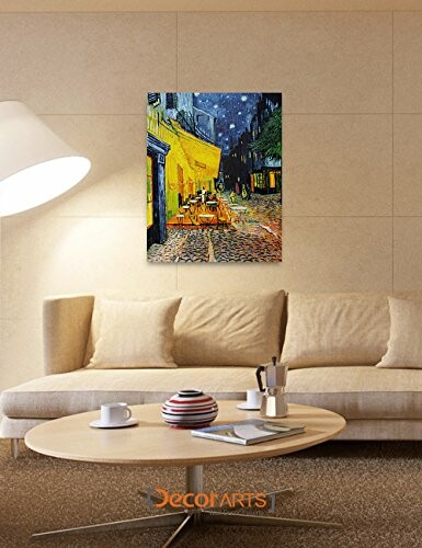 Modern living room with a painting on the wall above a beige sofa.