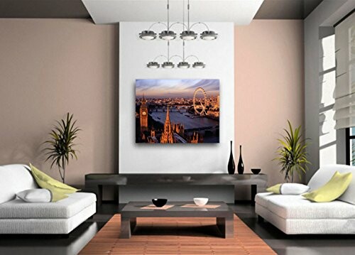 Modern living room with cityscape artwork and sleek decor.