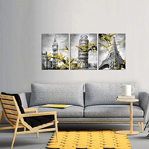 Living room with gray sofa, yellow accents, and wall art of famous landmarks.